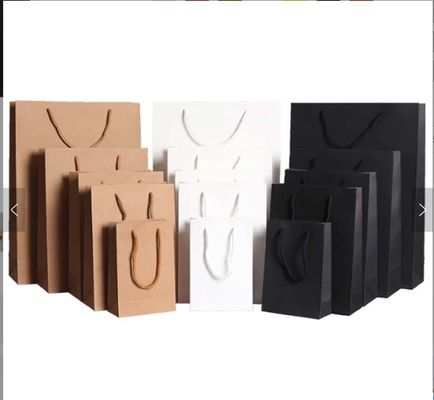 Túi giấy Kraft màu nâu túi mua sắm Offset in ấn quần áo túi giấy Logo tùy chỉnh